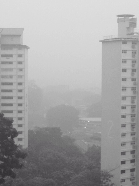Bukit TImah in rain enhanced haze